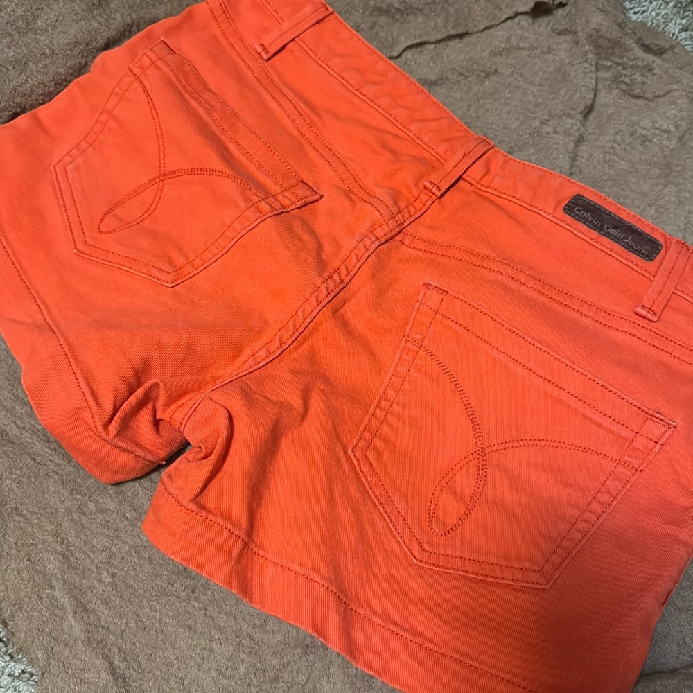 Bright orange Calvin Klein denim shorts 🎃